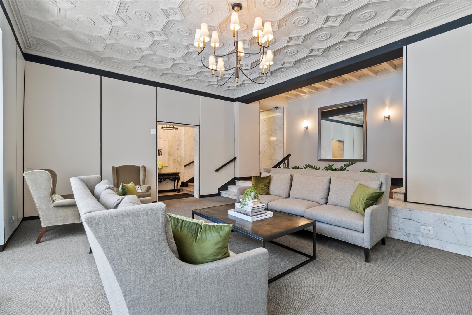 6101 North Sheridan Road, Unit 14C Chicago, IL 60660 - Photo 3 of 20 a living room with furniture and a chandelier