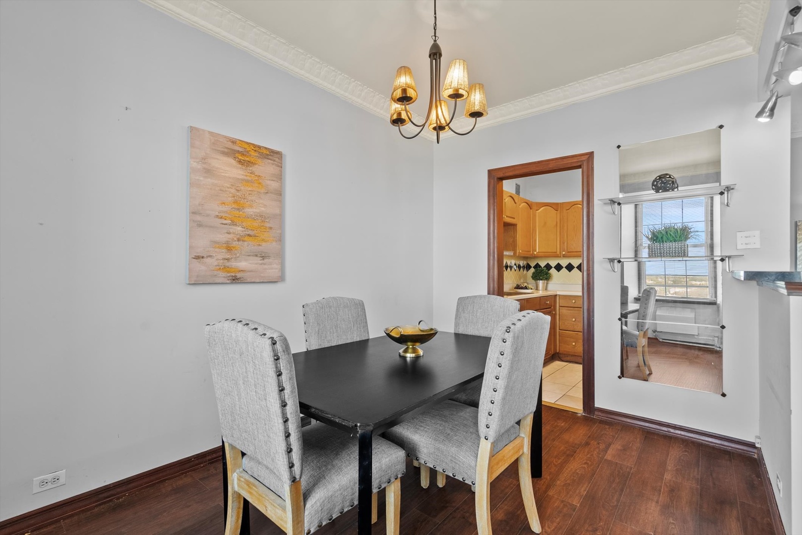 6101 North Sheridan Road, Unit 14C Chicago, IL 60660 - Photo 10 of 20 a view of a dining room with furniture and wooden floor