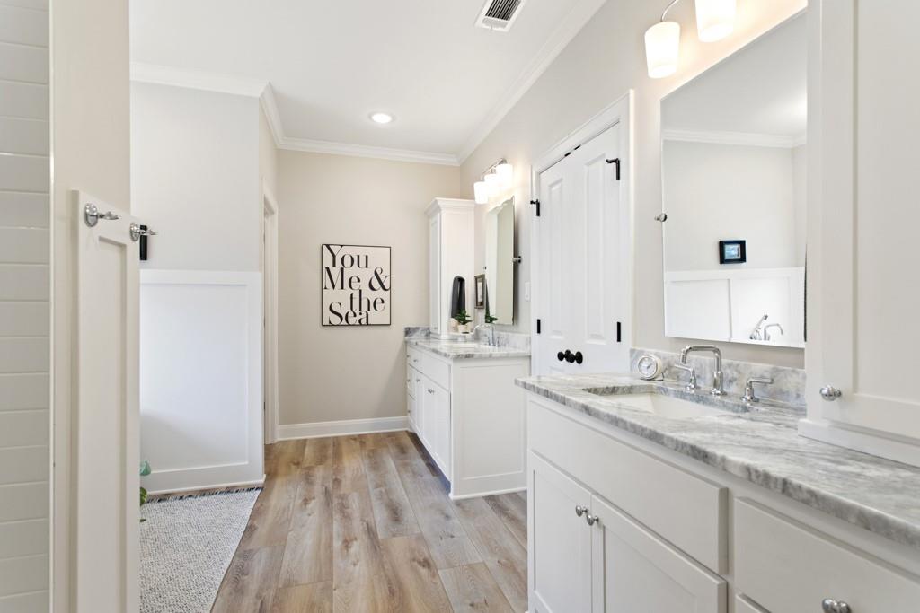 23630 Champion Drive Lindale, TX 75771 - Photo 27 of 36 a spacious bathroom with a granite countertop sink a mirror a shower and a bathtub