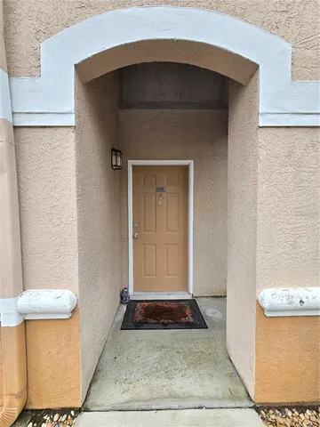 a front view of a house with white door