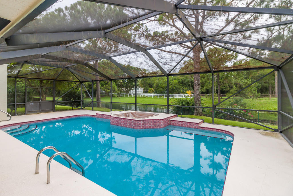1212 Raintree Lane Wellington, FL 33414 - Photo 17 of 21 Pool-Spa-Backyard View 1