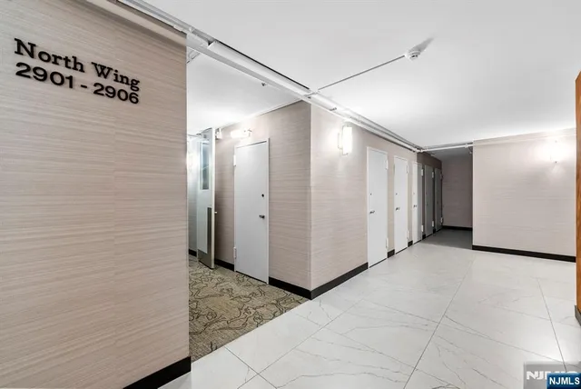 a view of a hallway with closet