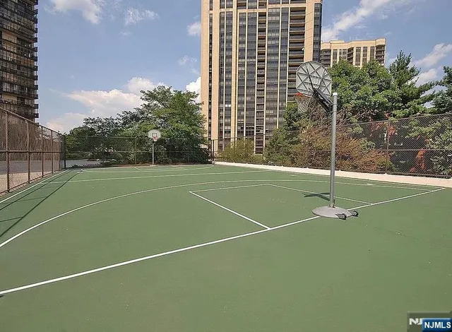 an aerial view of a house with a yard and lake view