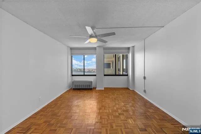 a view of an empty room with a window