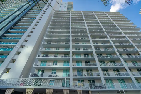 a view of building with glass windows