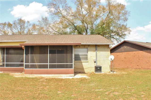 a view of a large pool with an outdoor space