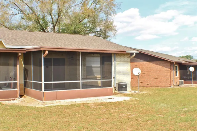 a view of a house with a backyard and a window