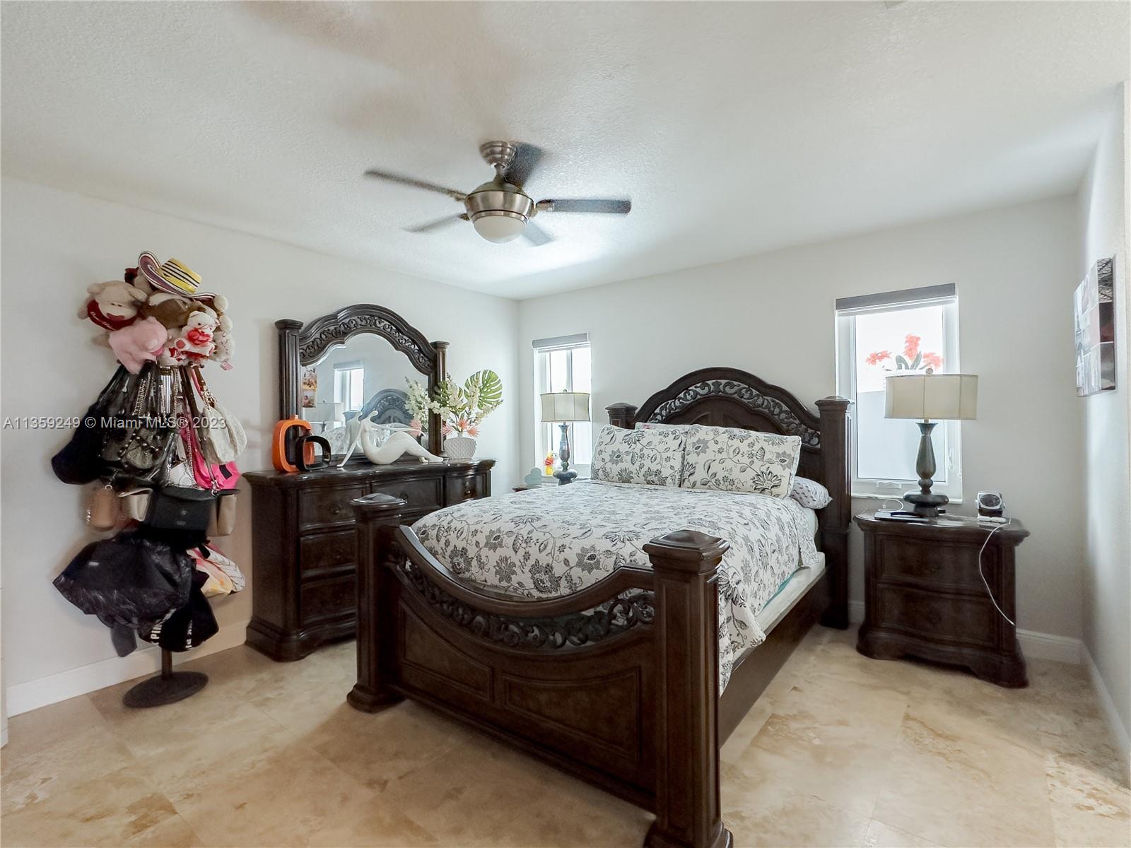 Kendale Lakes Miami, FL 33175 - Photo 21 of 39 a bedroom with bed and a chandelier