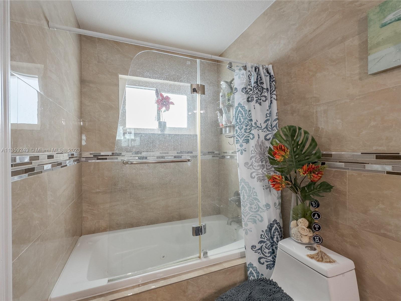 Kendale Lakes Miami, FL 33175 - Photo 25 of 39 a bath room with a bathtub and shower