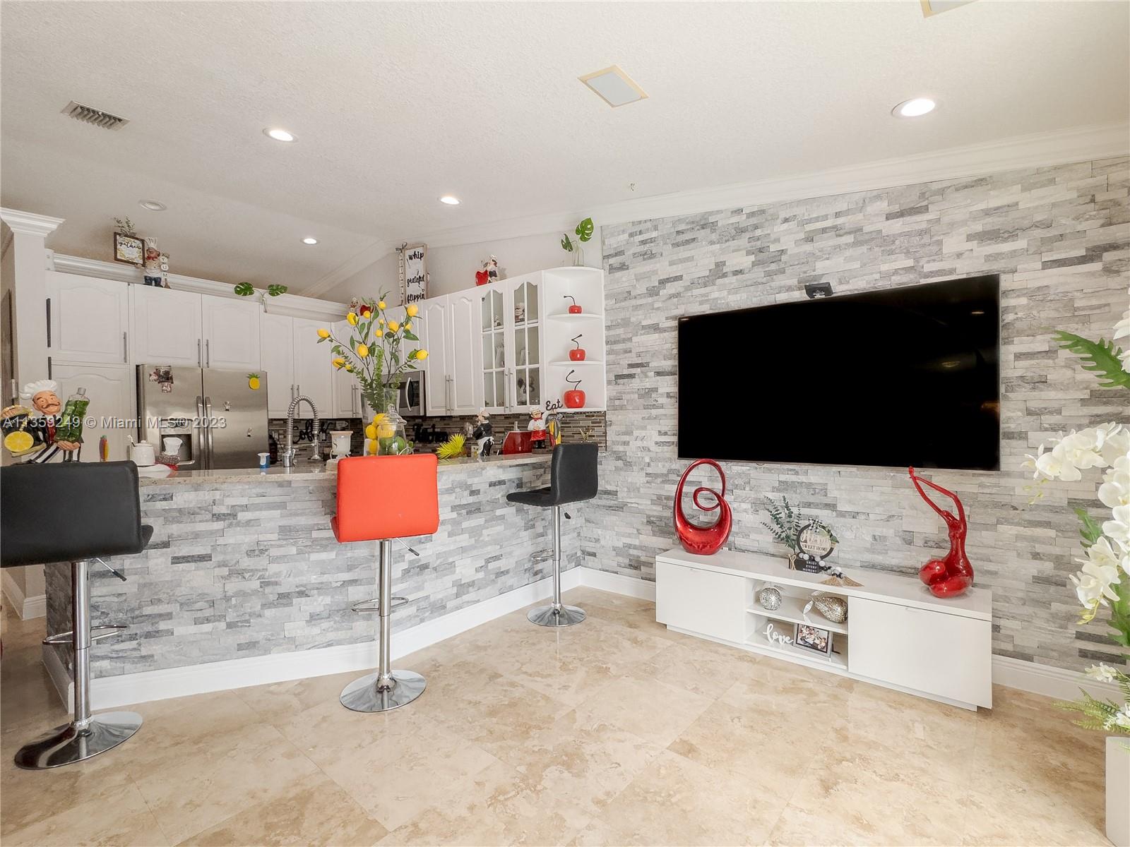 Kendale Lakes Miami, FL 33175 - Photo 29 of 39 a living room with furniture and a flat screen tv