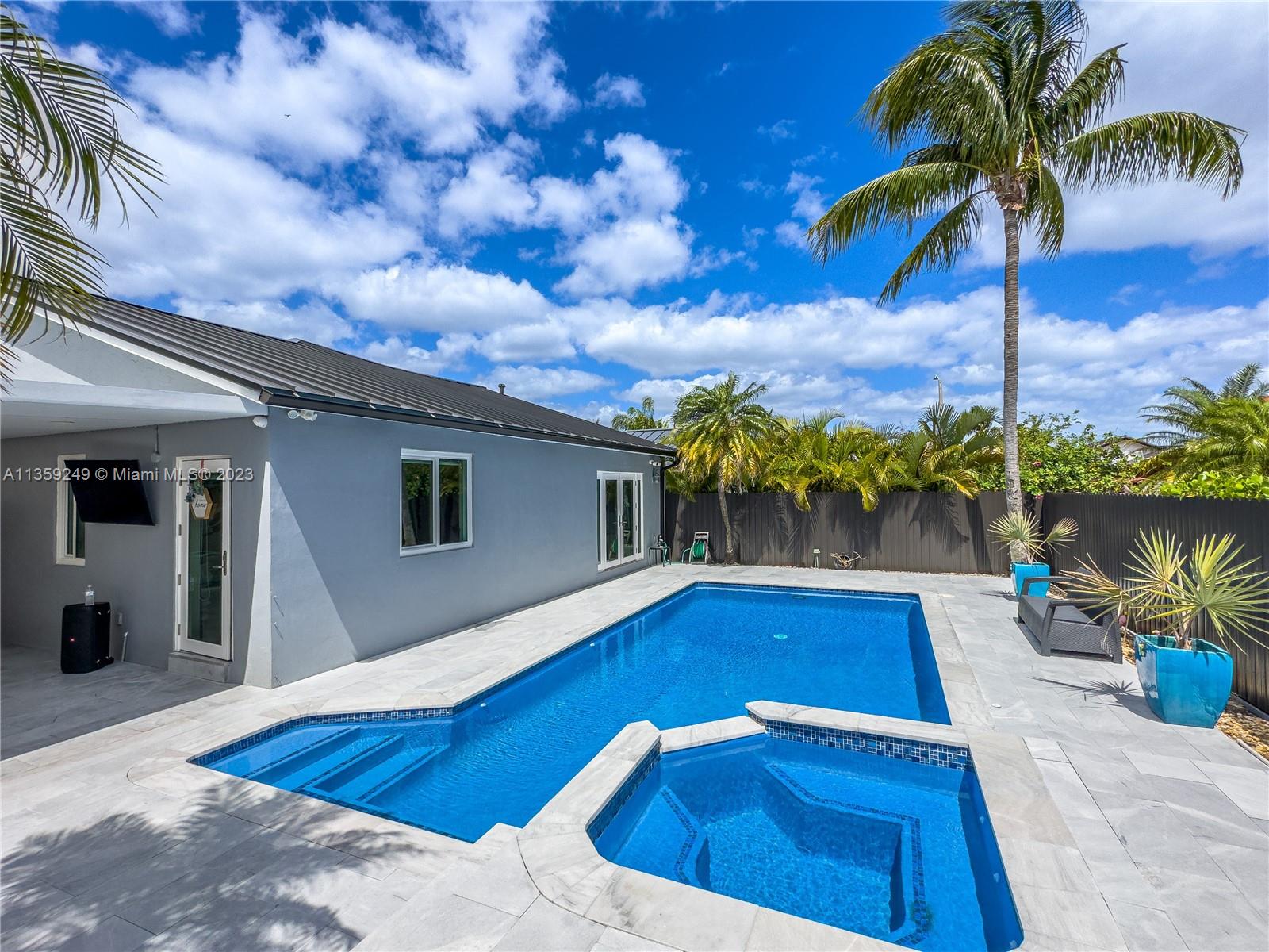 Kendale Lakes Miami, FL 33175 - Photo 3 of 39 a view of swimming pool with outdoor seating and plants