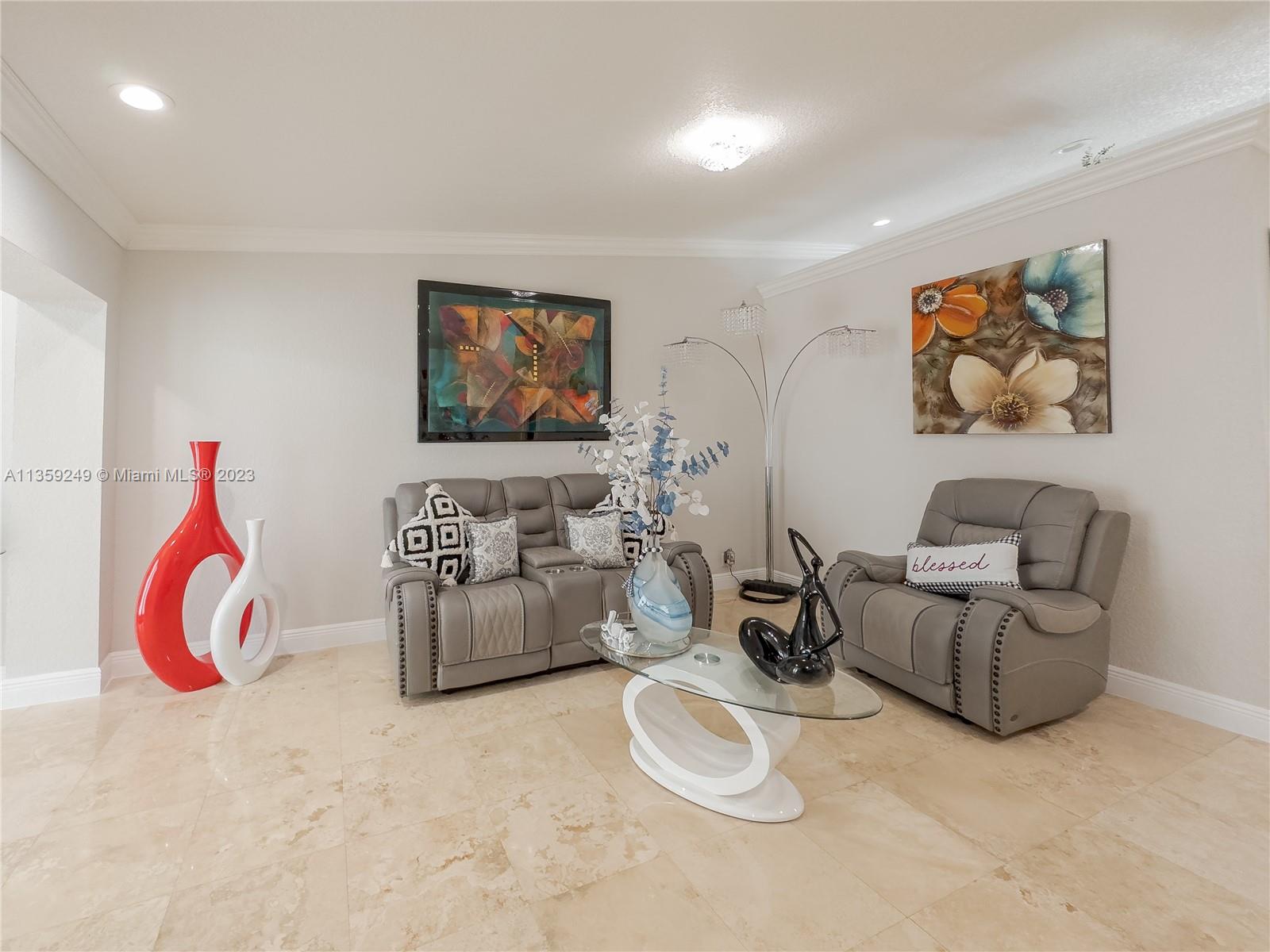 Kendale Lakes Miami, FL 33175 - Photo 6 of 39 a living room with furniture and wall paintings