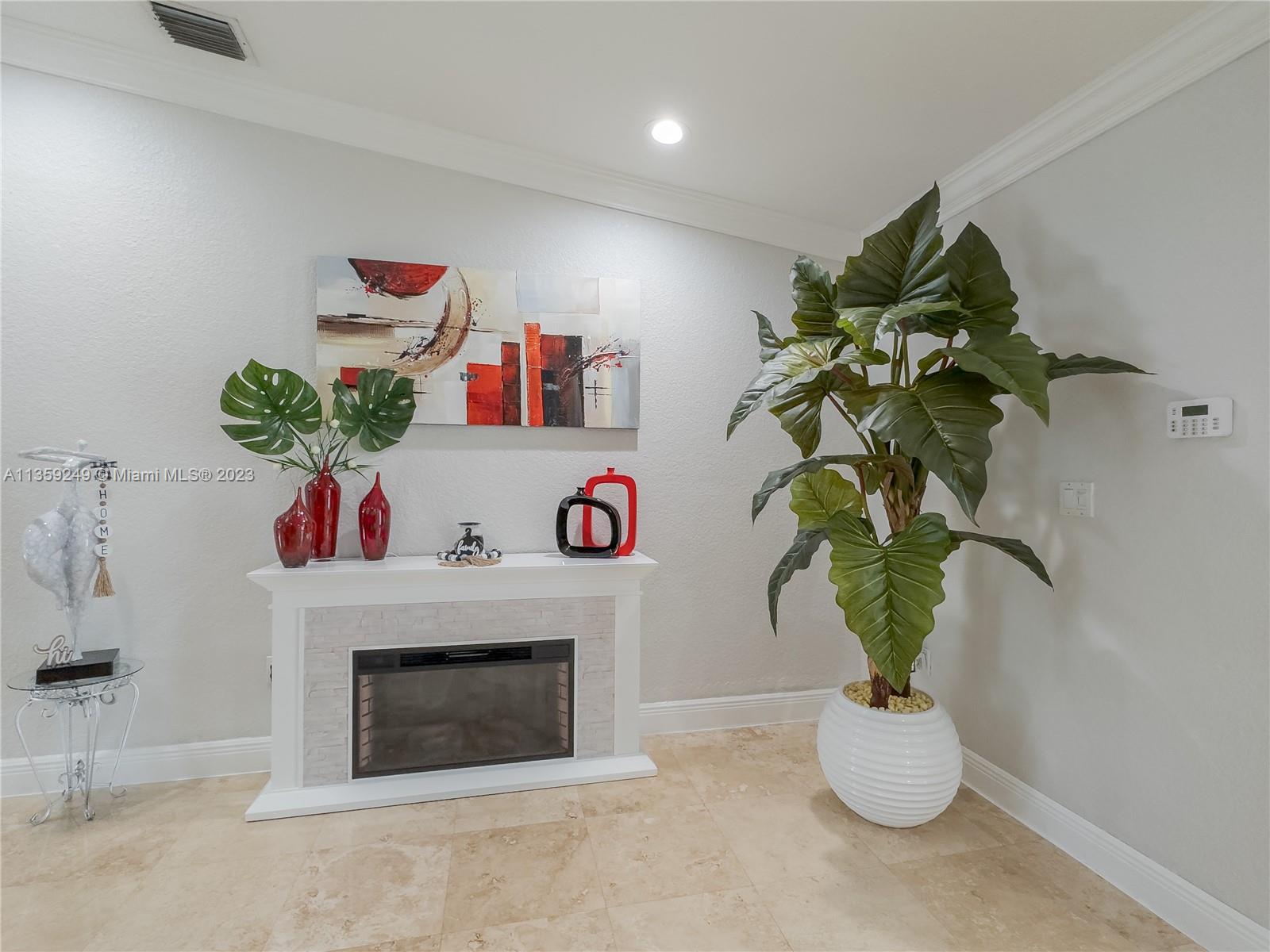 Kendale Lakes Miami, FL 33175 - Photo 8 of 39 a living room with furniture and a potted plant