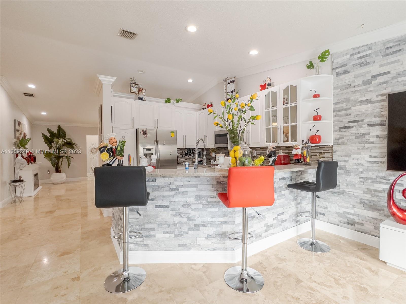 Kendale Lakes Miami, FL 33175 - Photo 9 of 39 a living room with lots of furniture and a glass door