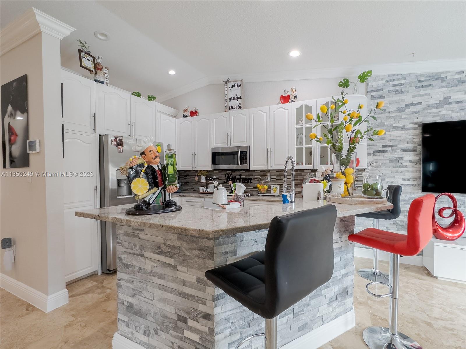 Kendale Lakes Miami, FL 33175 - Photo 10 of 39 a living room with fireplace furniture and a flat screen tv