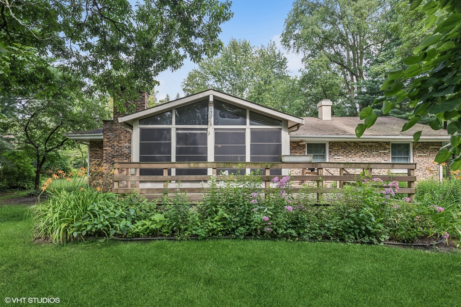 713 Hickory Road Woodstock, IL 60098 - Photo 13 of 13 a front view of a house with a yard
