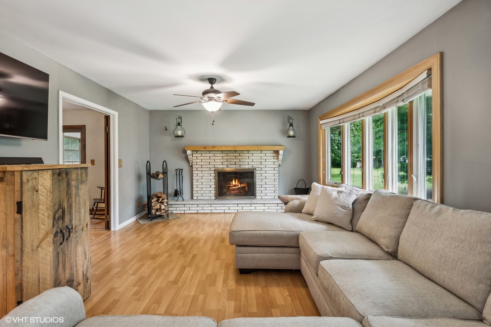 713 Hickory Road Woodstock, IL 60098 - Photo 4 of 13 a living room with furniture fireplace and flat screen tv