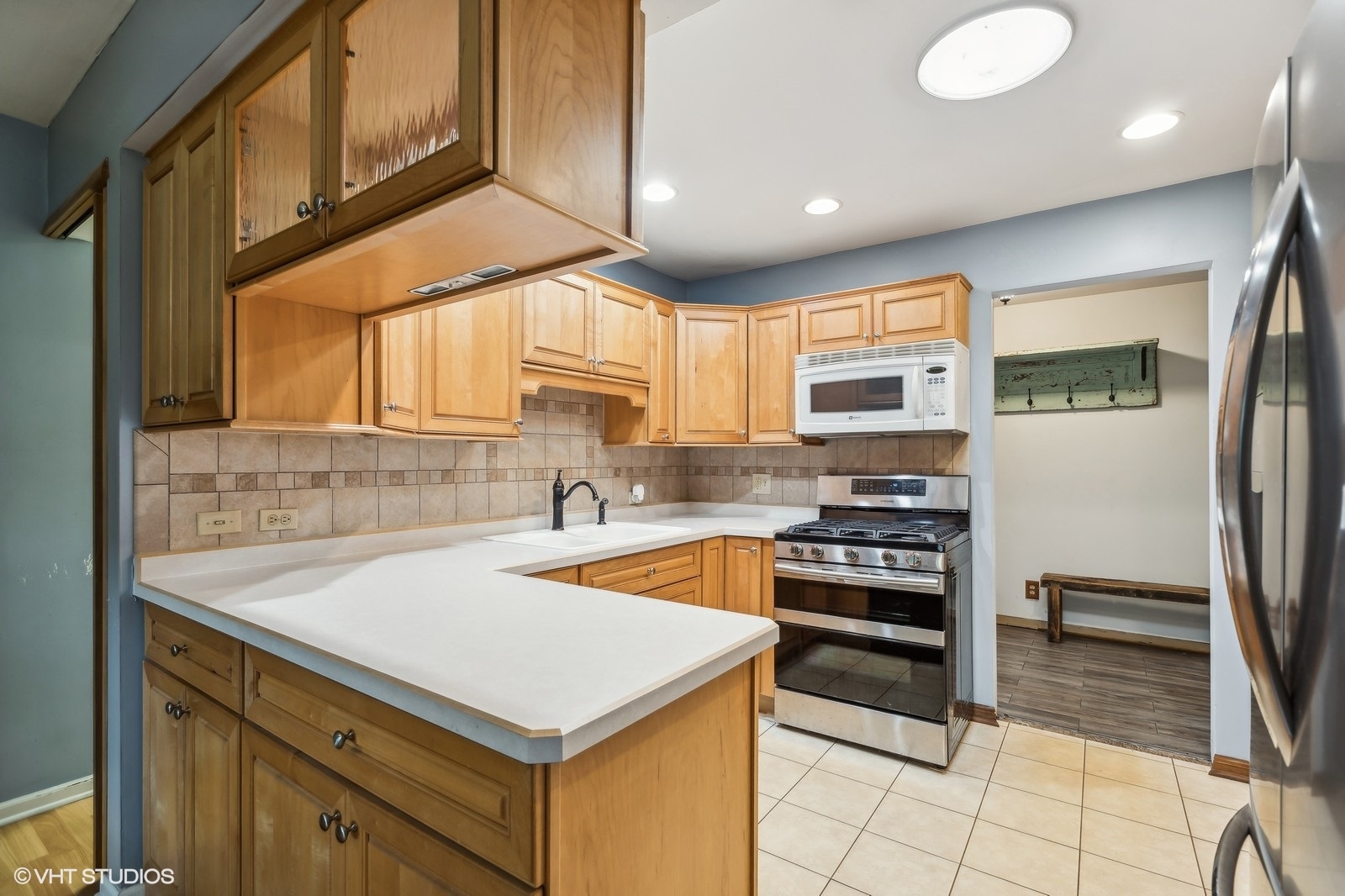 713 Hickory Road Woodstock, IL 60098 - Photo 5 of 13 a kitchen that has a cabinets and a stove