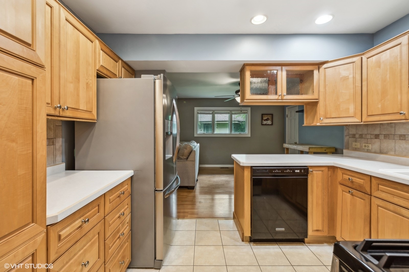 713 Hickory Road Woodstock, IL 60098 - Photo 6 of 13 a kitchen with stainless steel appliances granite countertop a refrigerator and a stove top oven