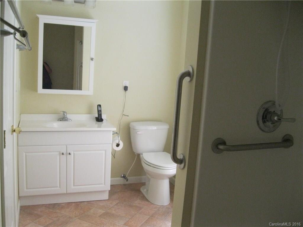 904 Fieldstone Road Mooresville, NC 28115 - Photo 11 of 15 a bathroom with a granite countertop toilet and sink