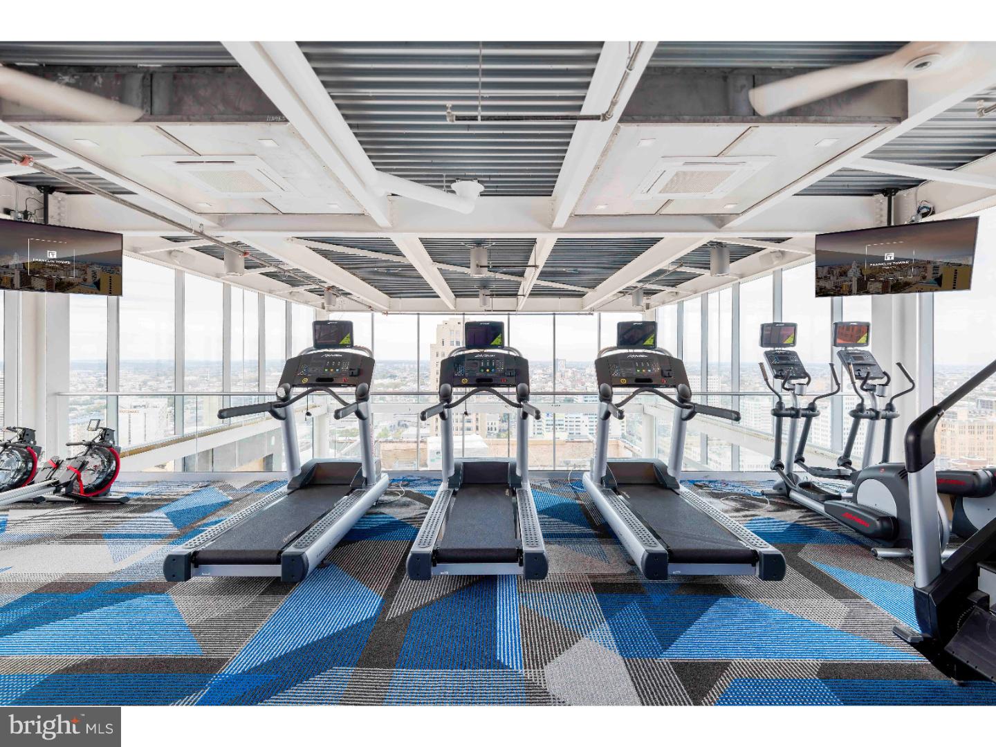 200 North 16th Street, Unit 313 Philadelphia, PA 19102 - Photo 18 of 20 a living room with gym equipment