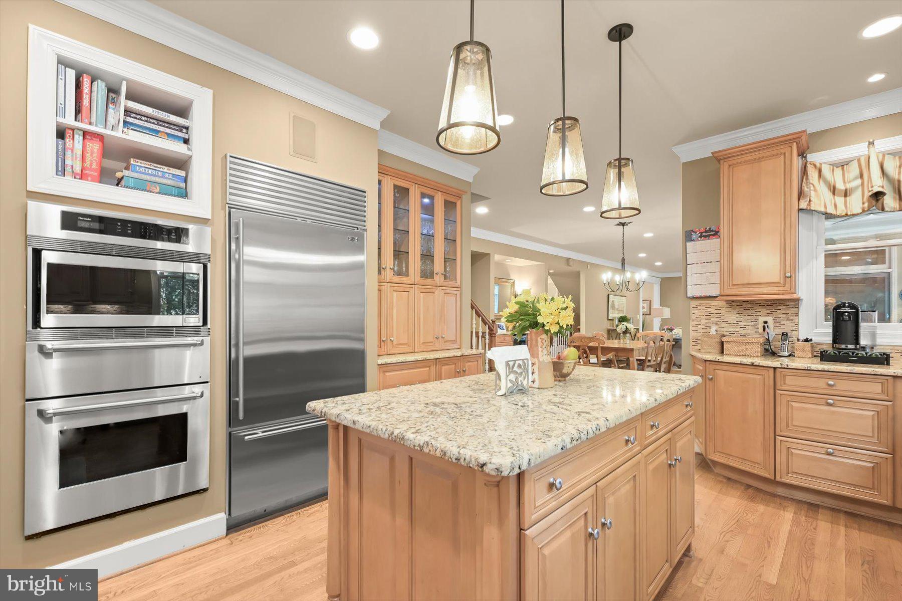 7828 Stable Way Potomac, MD 20854 - Photo 15 of 60 a kitchen with stainless steel appliances granite countertop a stove a sink and a refrigerator