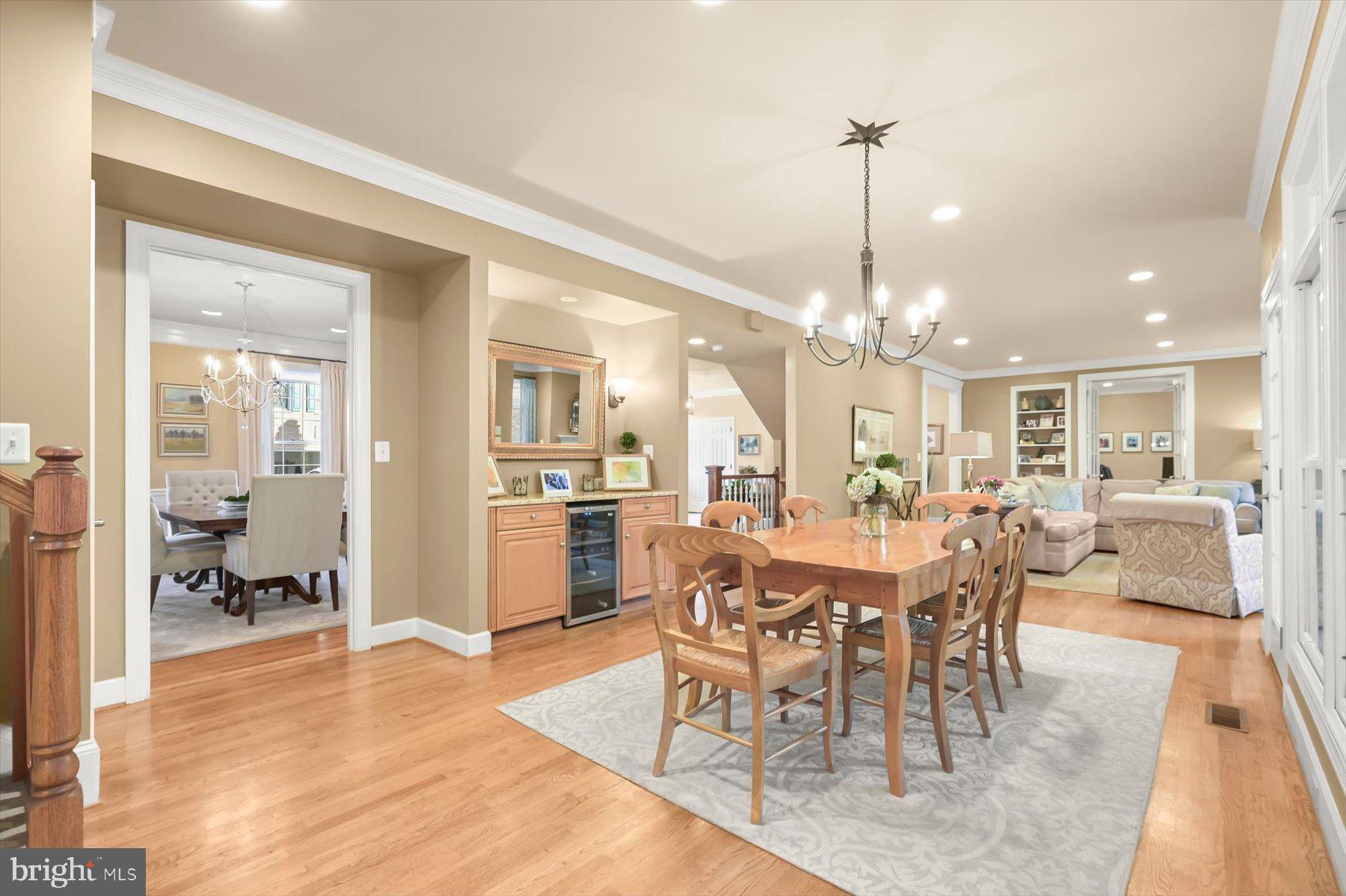 7828 Stable Way Potomac, MD 20854 - Photo 17 of 60 a view of a dining room and livingroom with furniture wooden floor a chandelier
