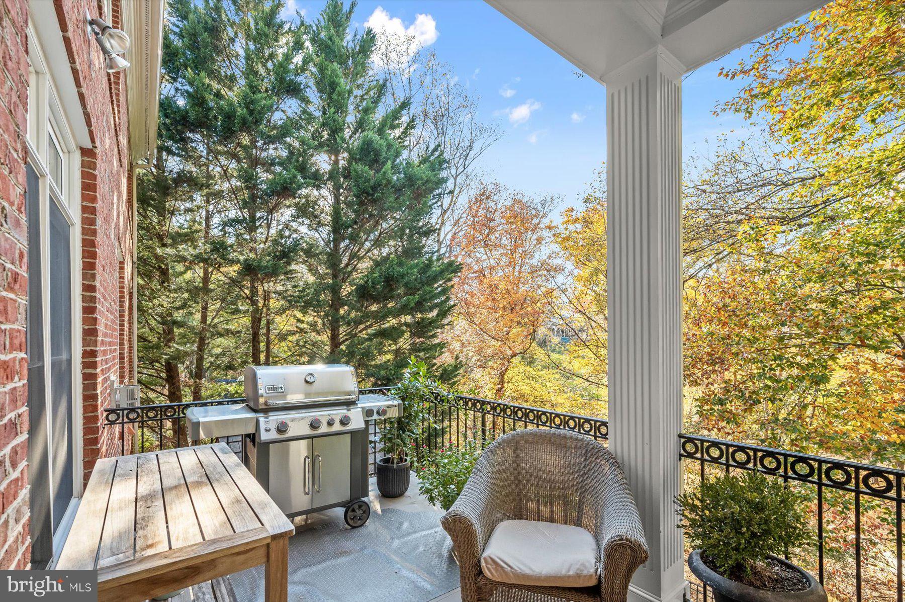 7828 Stable Way Potomac, MD 20854 - Photo 20 of 60 a living room with furniture and a floor to ceiling window