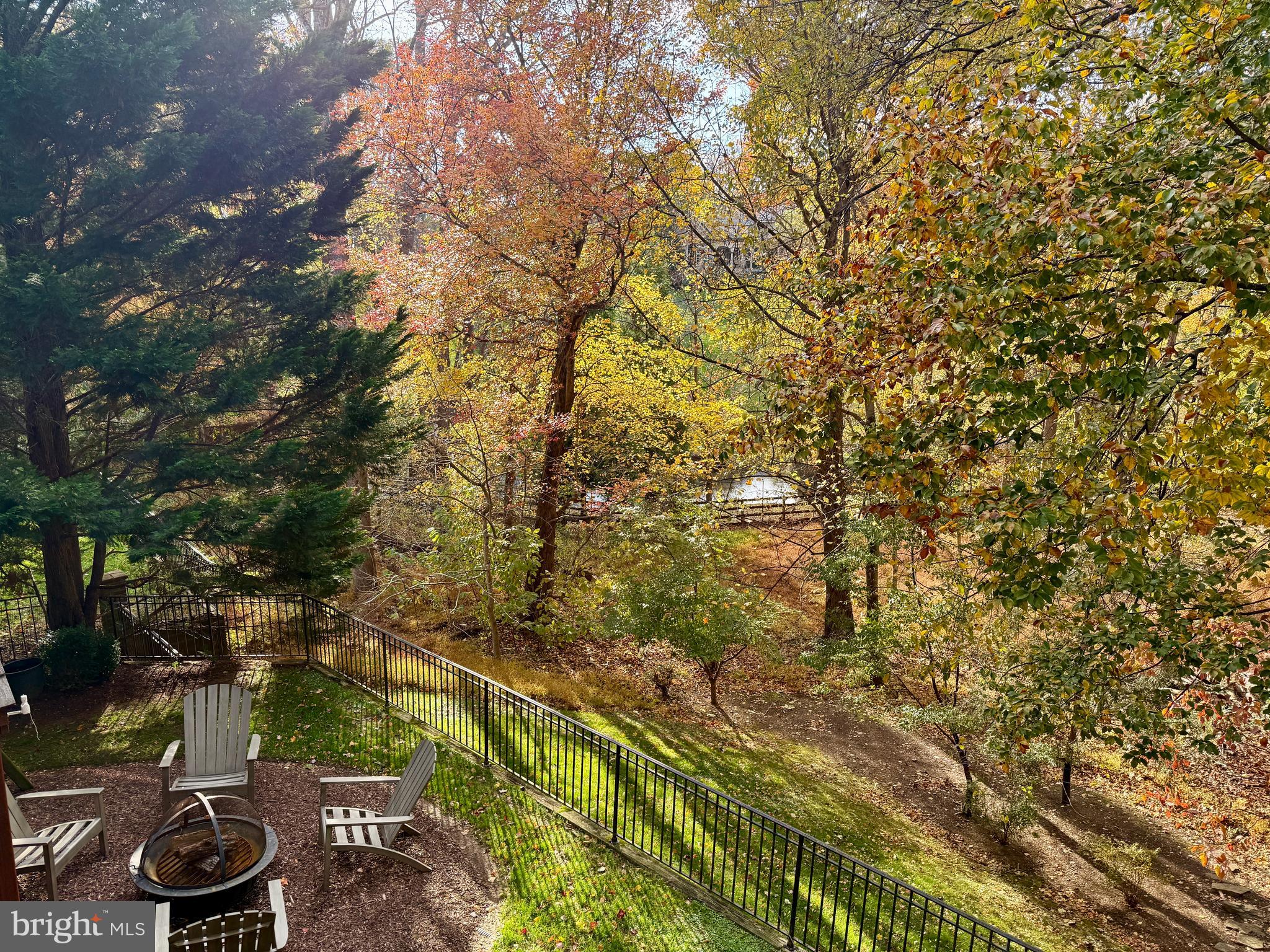 7828 Stable Way Potomac, MD 20854 - Photo 21 of 60 a view of a backyard with plants and a fountain