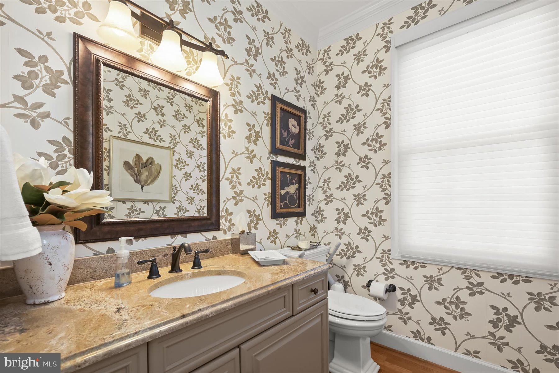 7828 Stable Way Potomac, MD 20854 - Photo 26 of 60 a bathroom with a granite countertop sink mirror vanity and toilet