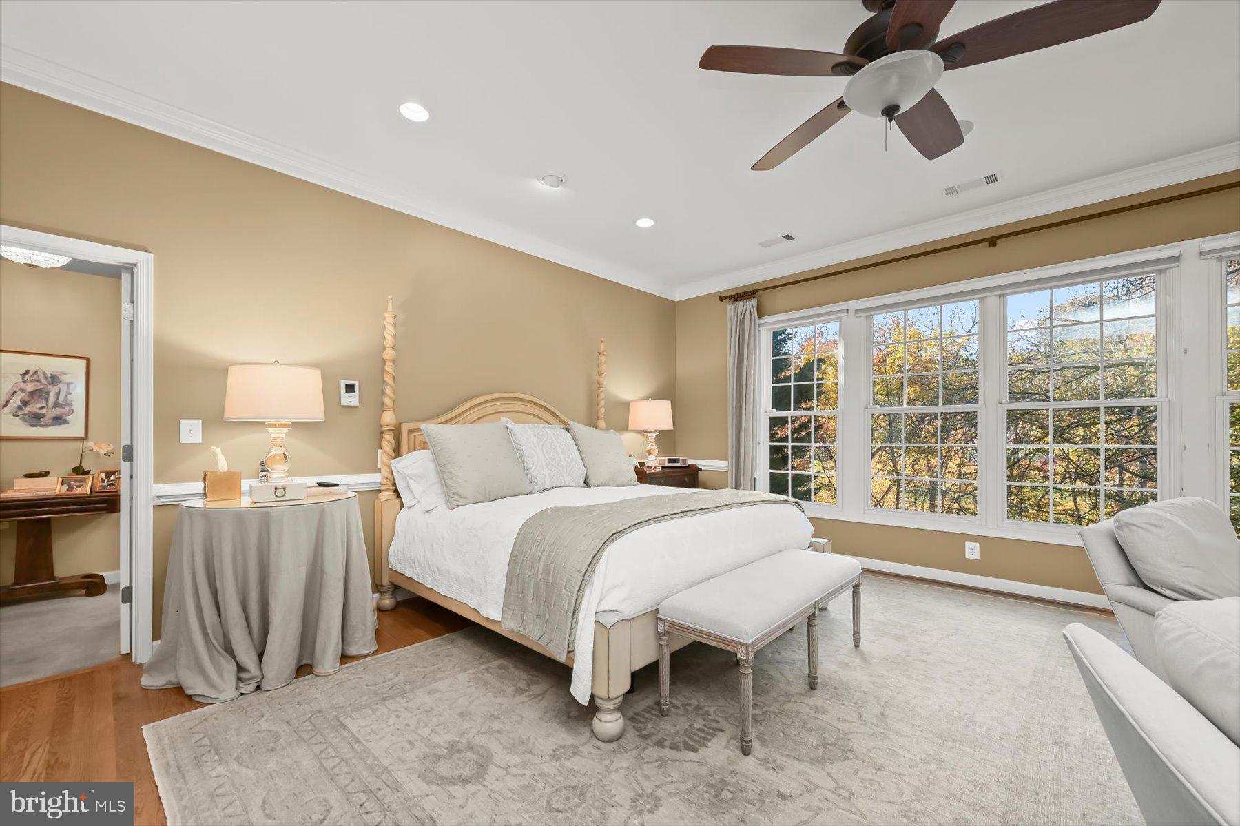 7828 Stable Way Potomac, MD 20854 - Photo 28 of 60 a spacious bedroom with a large bed and a large window
