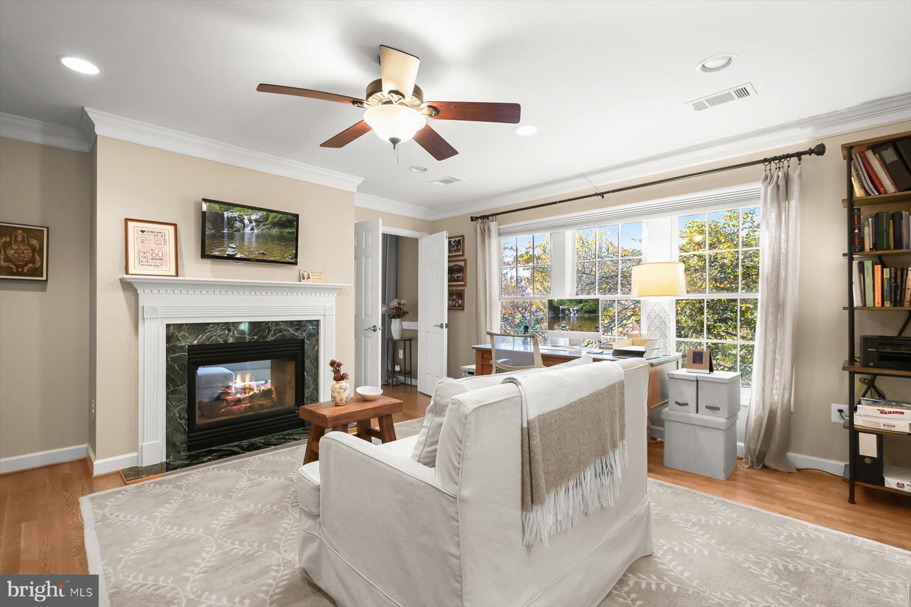 7828 Stable Way Potomac, MD 20854 - Photo 38 of 60 a living room with furniture and a fireplace