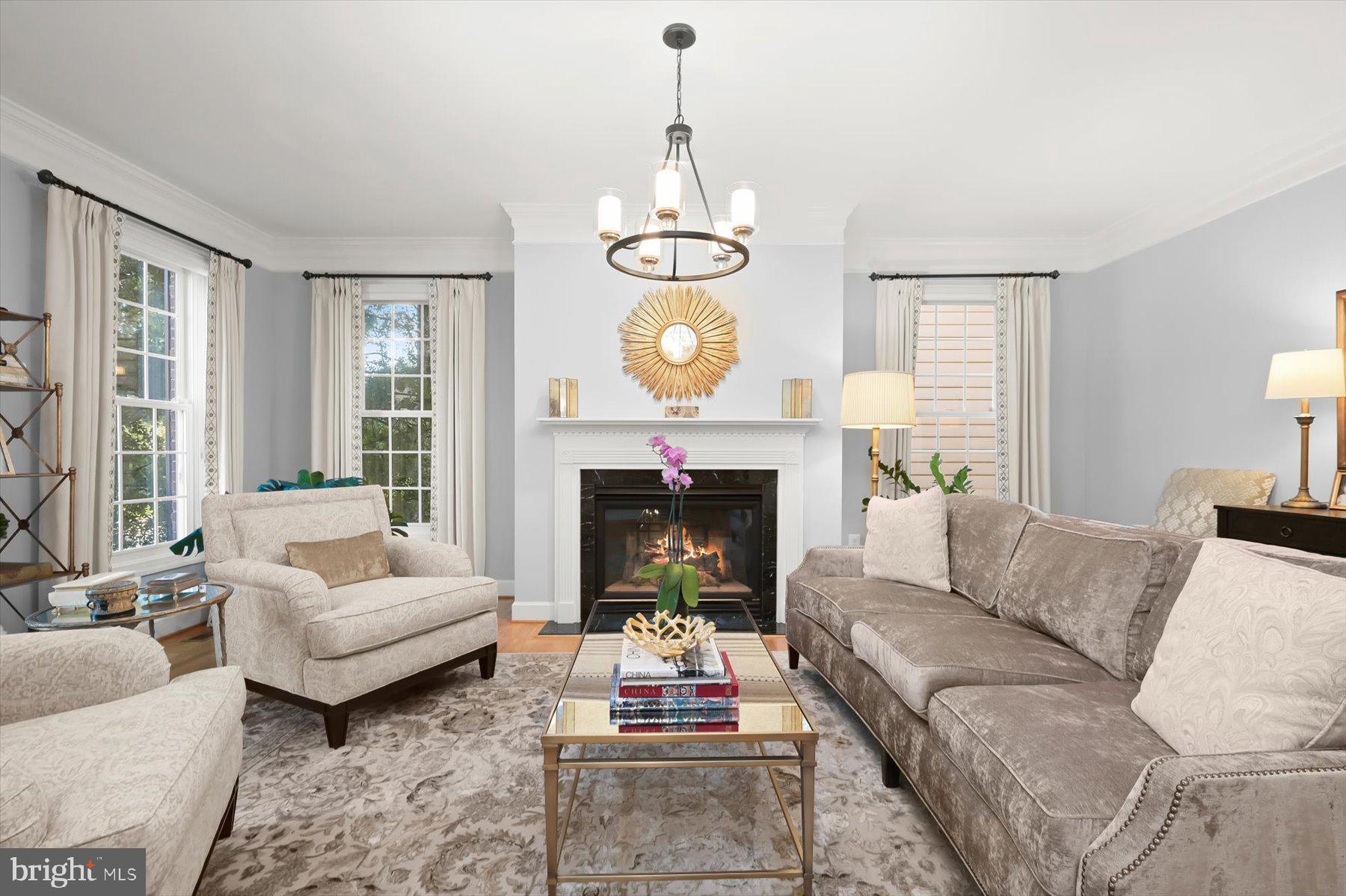 7828 Stable Way Potomac, MD 20854 - Photo 4 of 60 a living room with furniture a fireplace and a large window