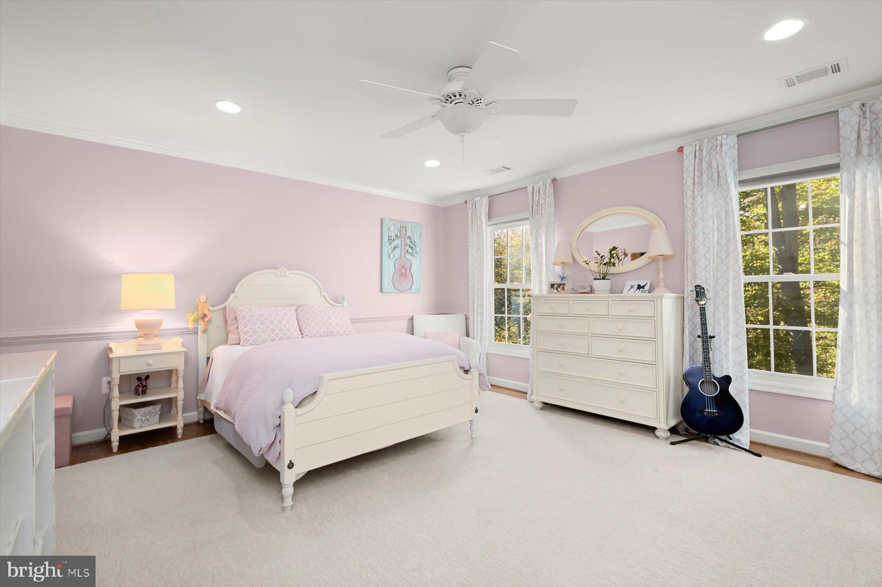 7828 Stable Way Potomac, MD 20854 - Photo 44 of 60 a bedroom with a bed and a large window