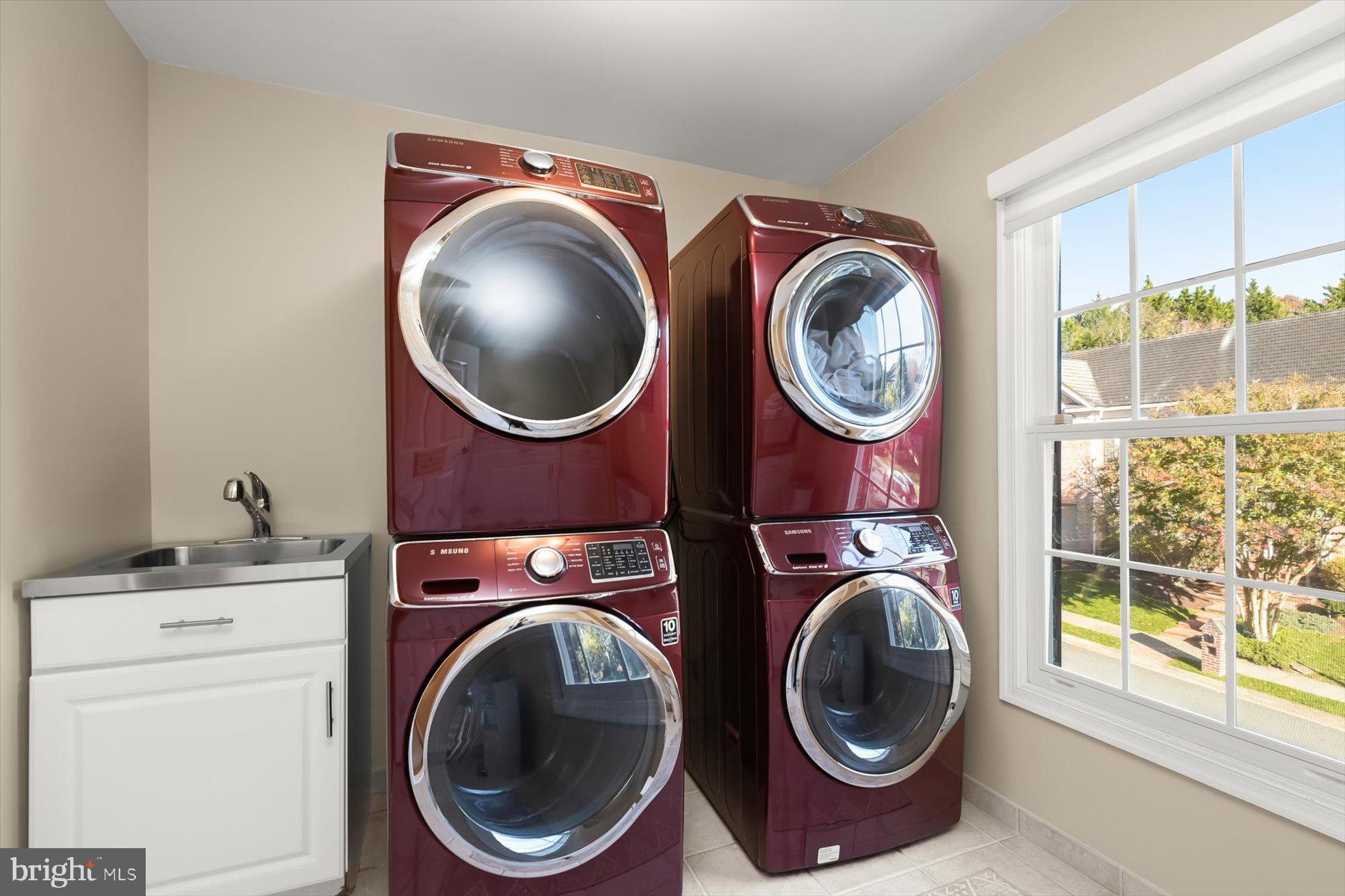 7828 Stable Way Potomac, MD 20854 - Photo 45 of 60 a utility room with dryer and washer
