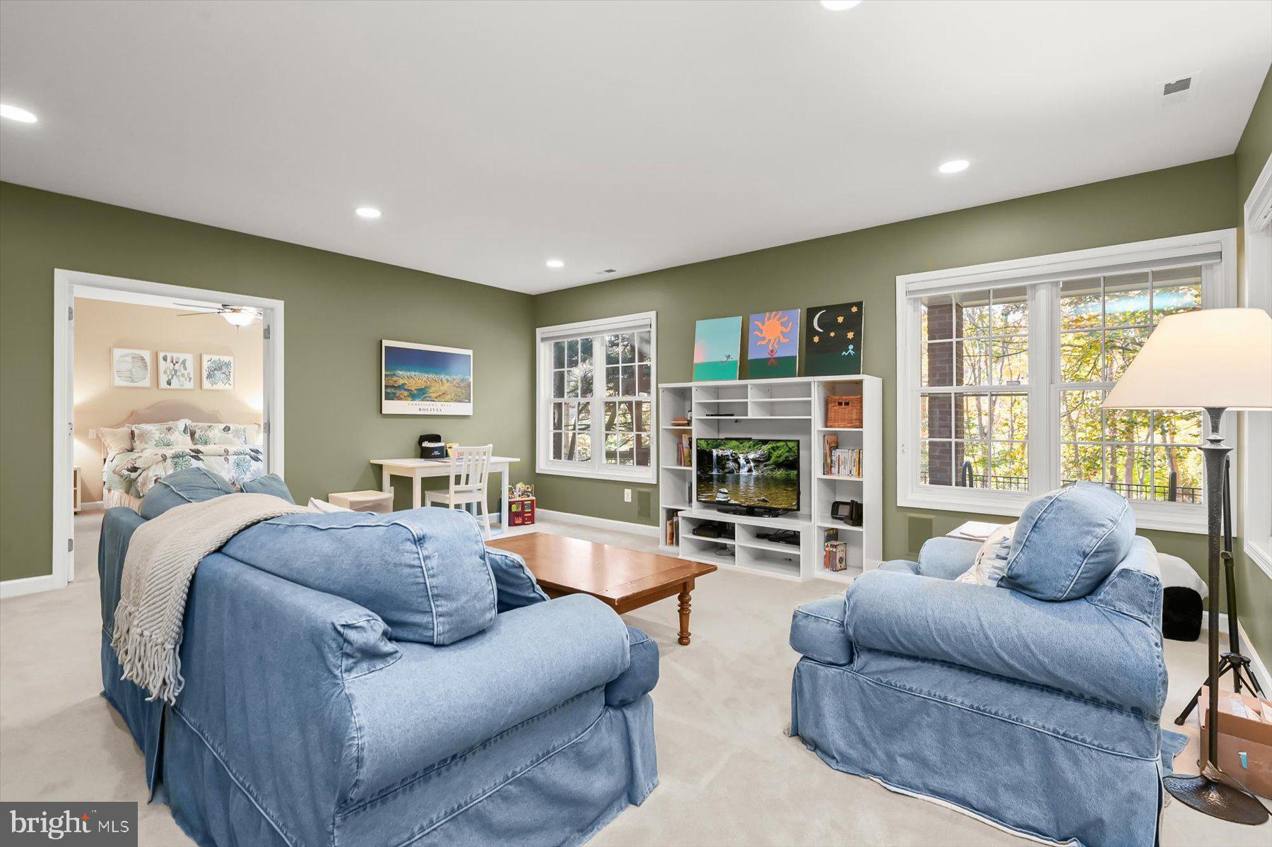 7828 Stable Way Potomac, MD 20854 - Photo 47 of 60 a living room with furniture and a flat screen tv