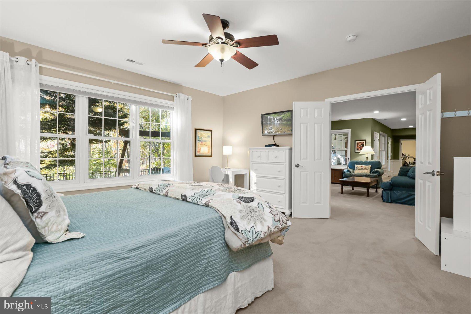 7828 Stable Way Potomac, MD 20854 - Photo 49 of 60 a spacious bedroom with a bed and a large window