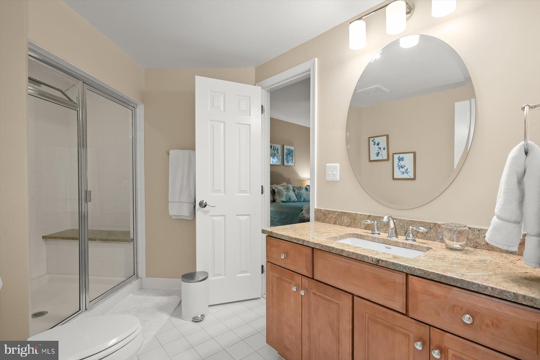 7828 Stable Way Potomac, MD 20854 - Photo 50 of 60 a bathroom with a granite countertop sink mirror and toilet