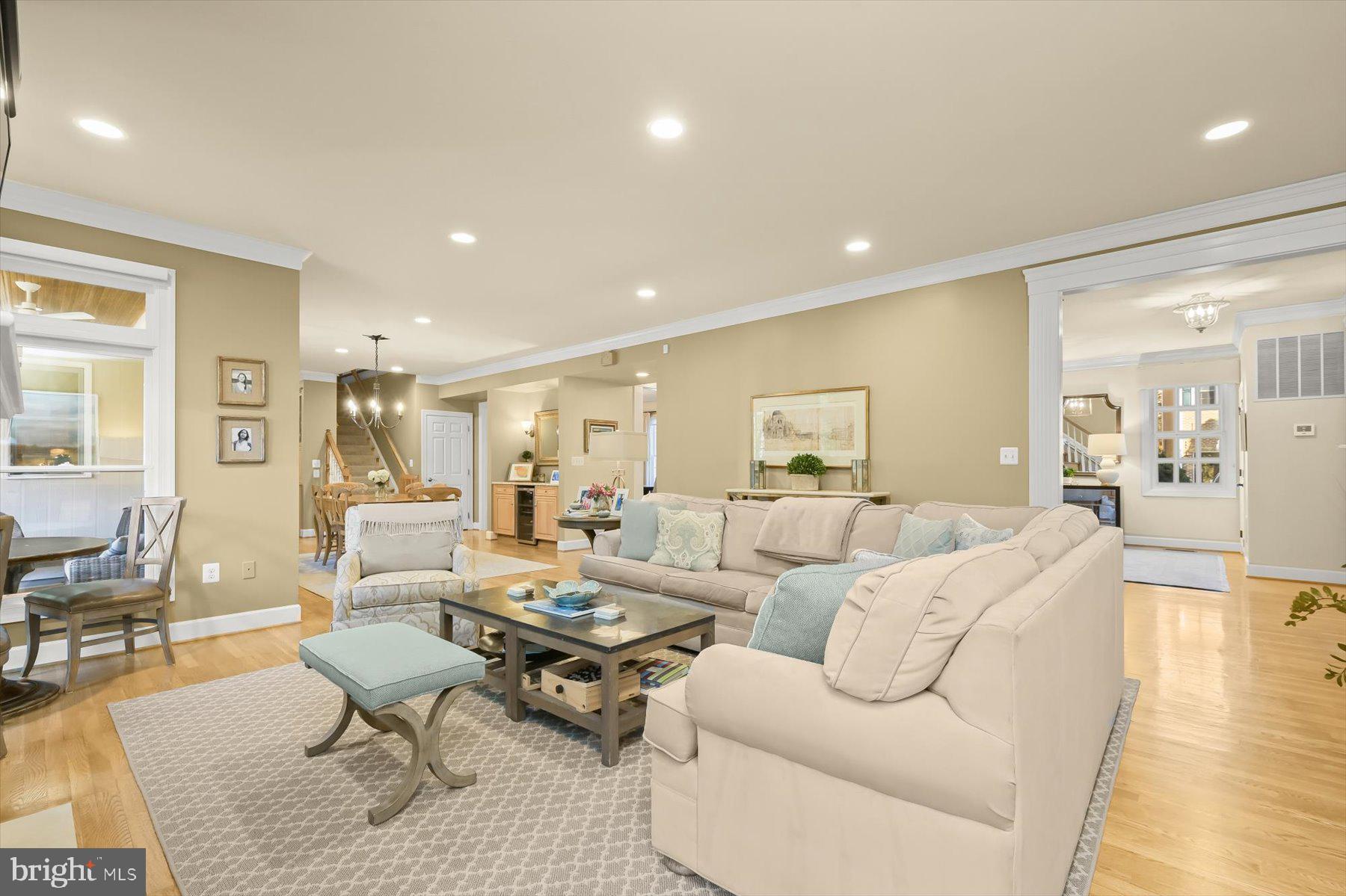 7828 Stable Way Potomac, MD 20854 - Photo 10 of 60 a living room with furniture wooden floor and a table