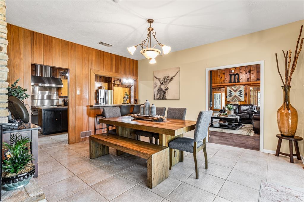 916 Kimbrough Road Azle, TX 76020 - Photo 18 of 40 a view of a livingroom with furniture and a ceiling fan