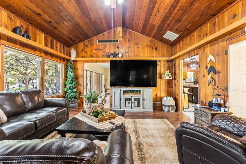916 Kimbrough Road Azle, TX 76020 - Photo 22 of 40 a living room with furniture and a flat screen tv