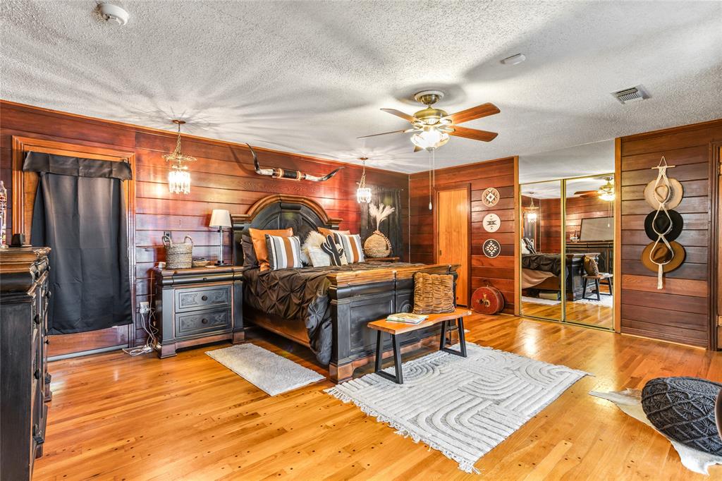 916 Kimbrough Road Azle, TX 76020 - Photo 27 of 40 a living room with patio furniture and a chandelier