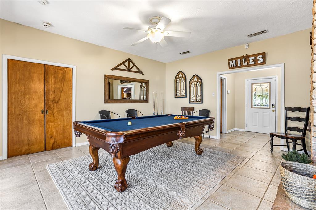 916 Kimbrough Road Azle, TX 76020 - Photo 7 of 40 a room with pool table and windows