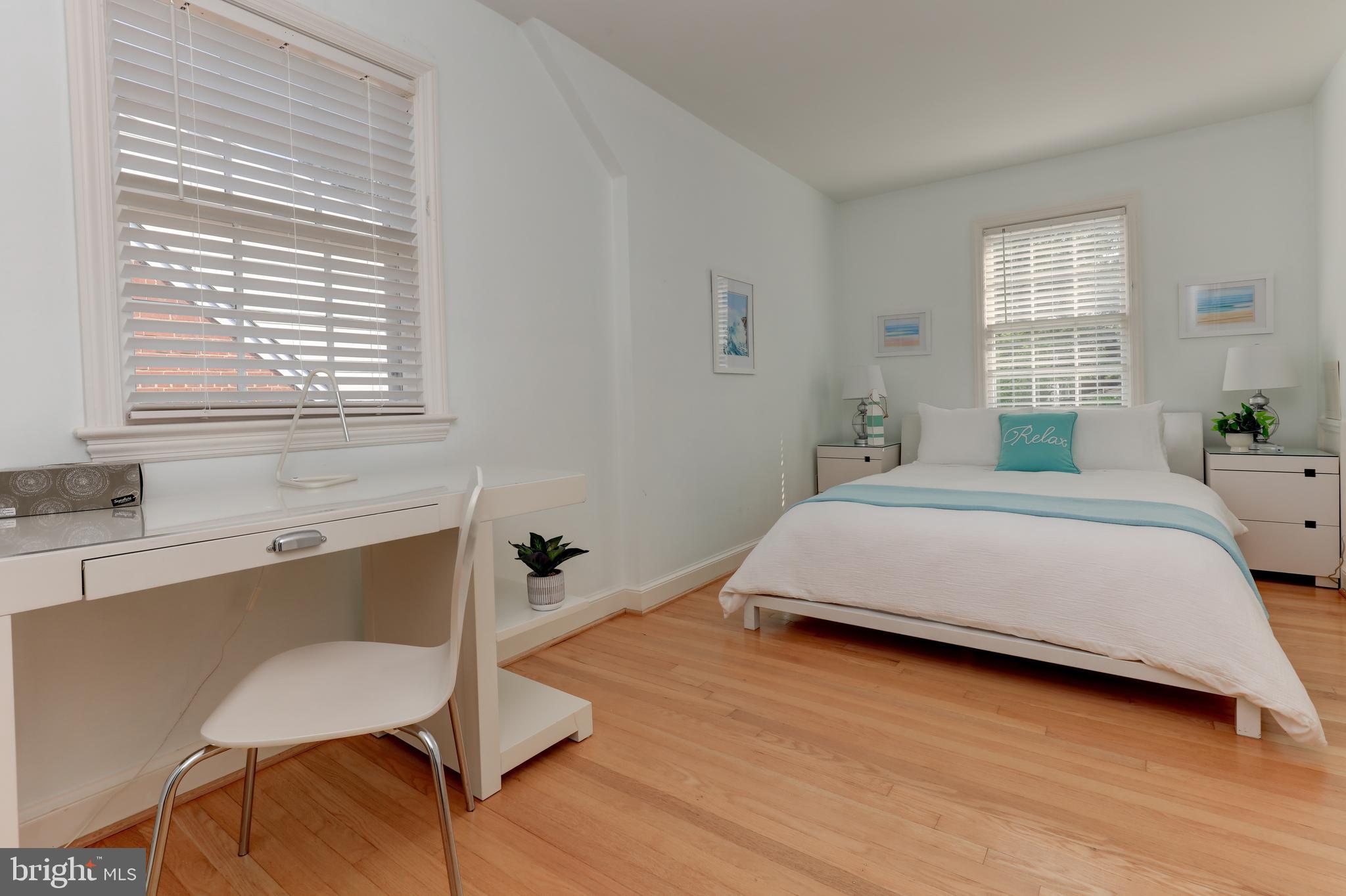 1723 Oakcrest Drive Alexandria, VA 22302 - Photo 11 of 17 a bedroom with a bed windows and wooden floor
