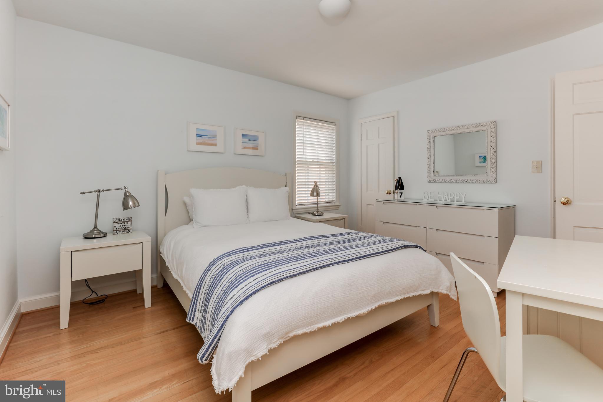 1723 Oakcrest Drive Alexandria, VA 22302 - Photo 12 of 17 a bedroom with a bed and a table