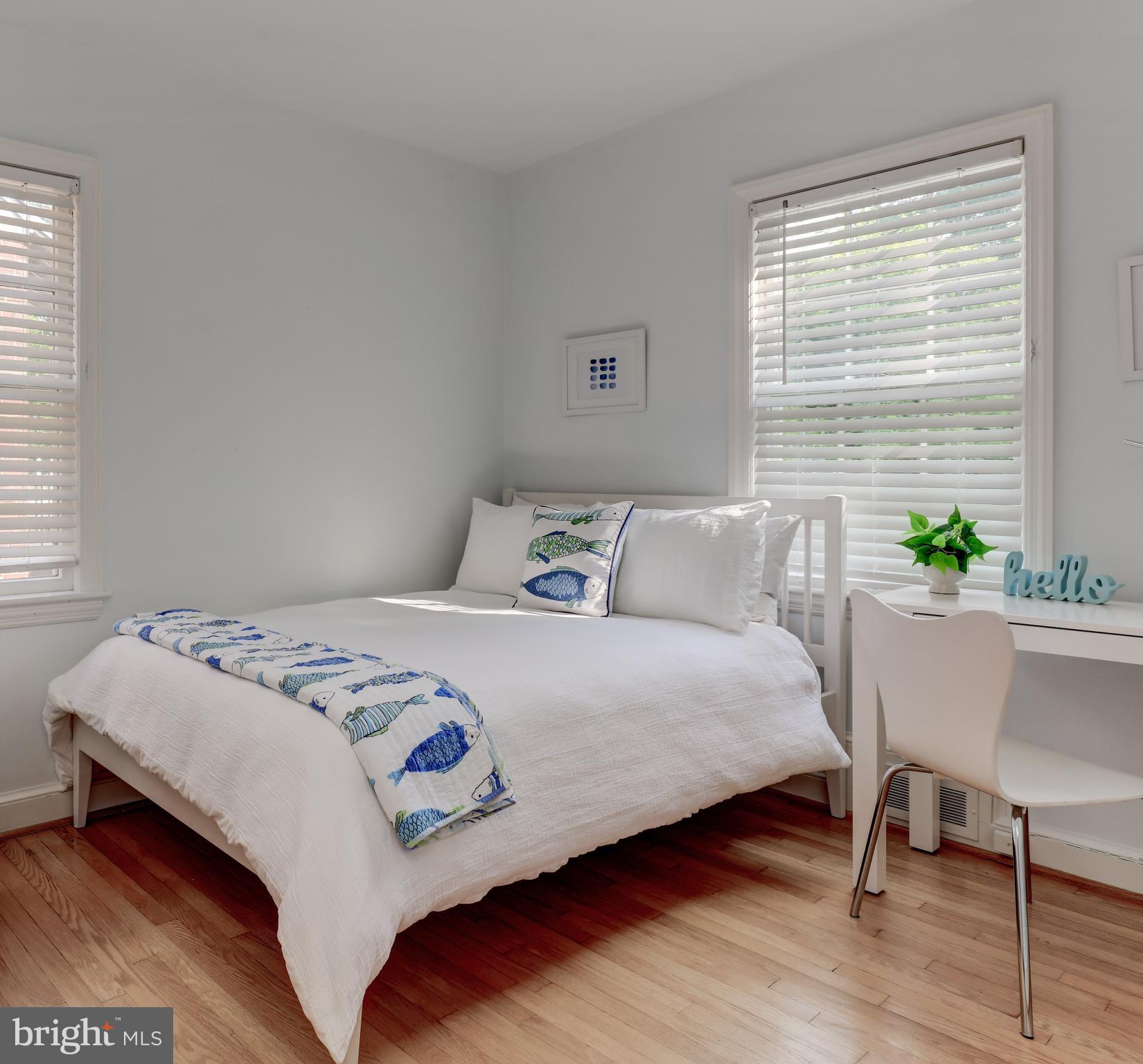 1723 Oakcrest Drive Alexandria, VA 22302 - Photo 13 of 17 a bedroom with a bed and a table