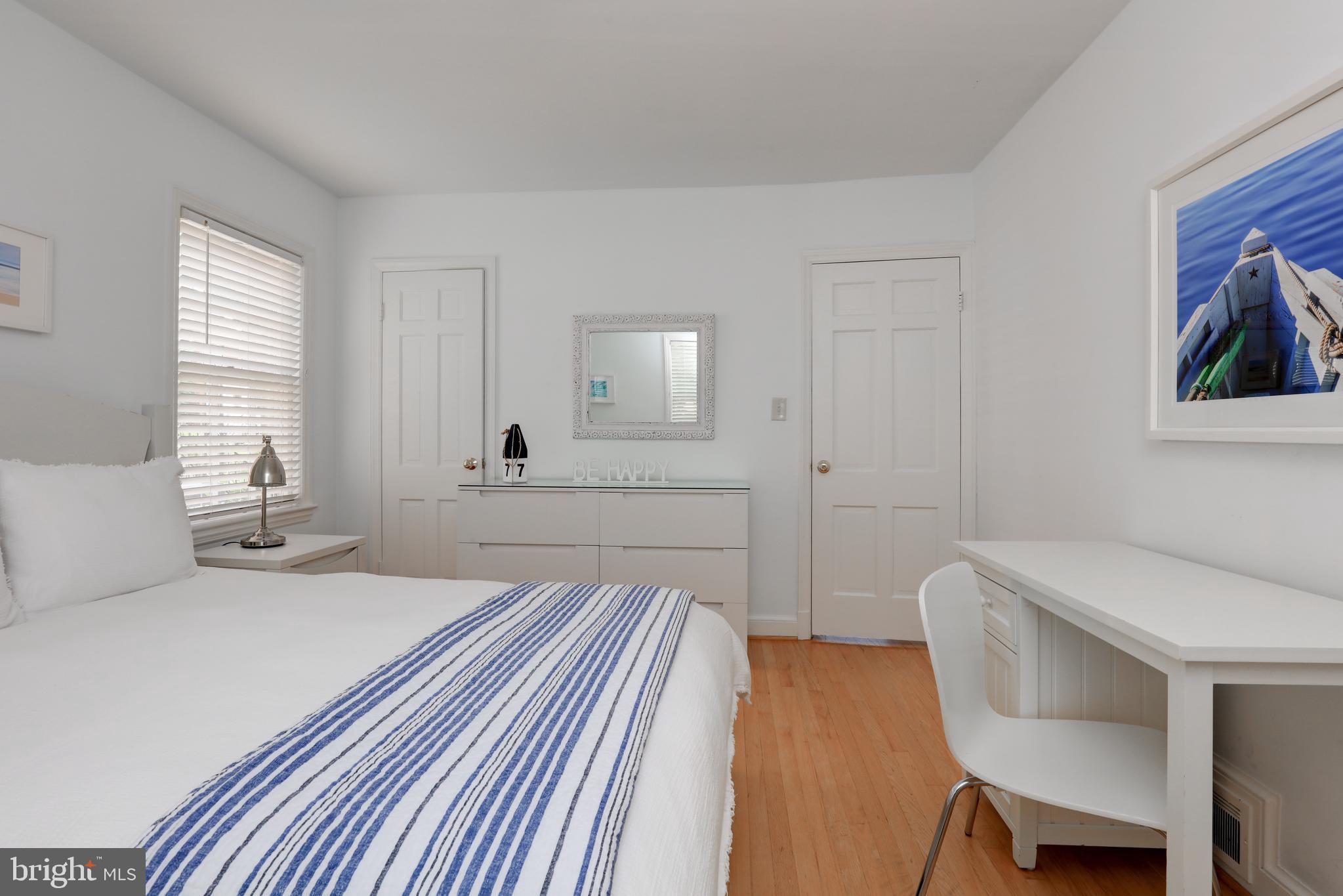 1723 Oakcrest Drive Alexandria, VA 22302 - Photo 14 of 17 a bedroom with a bed and a chair