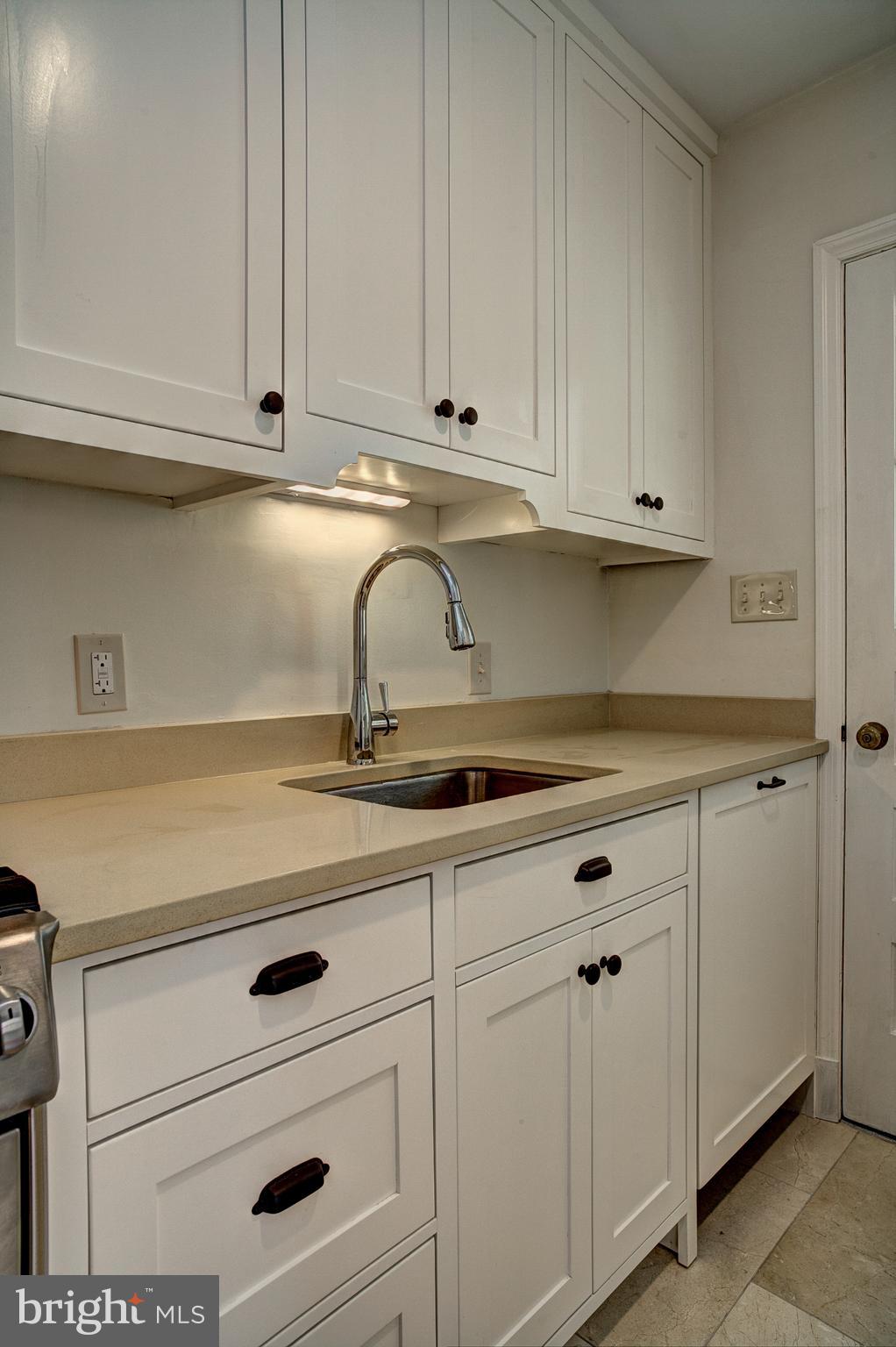1723 Oakcrest Drive Alexandria, VA 22302 - Photo 15 of 17 a kitchen with white cabinets and white appliances