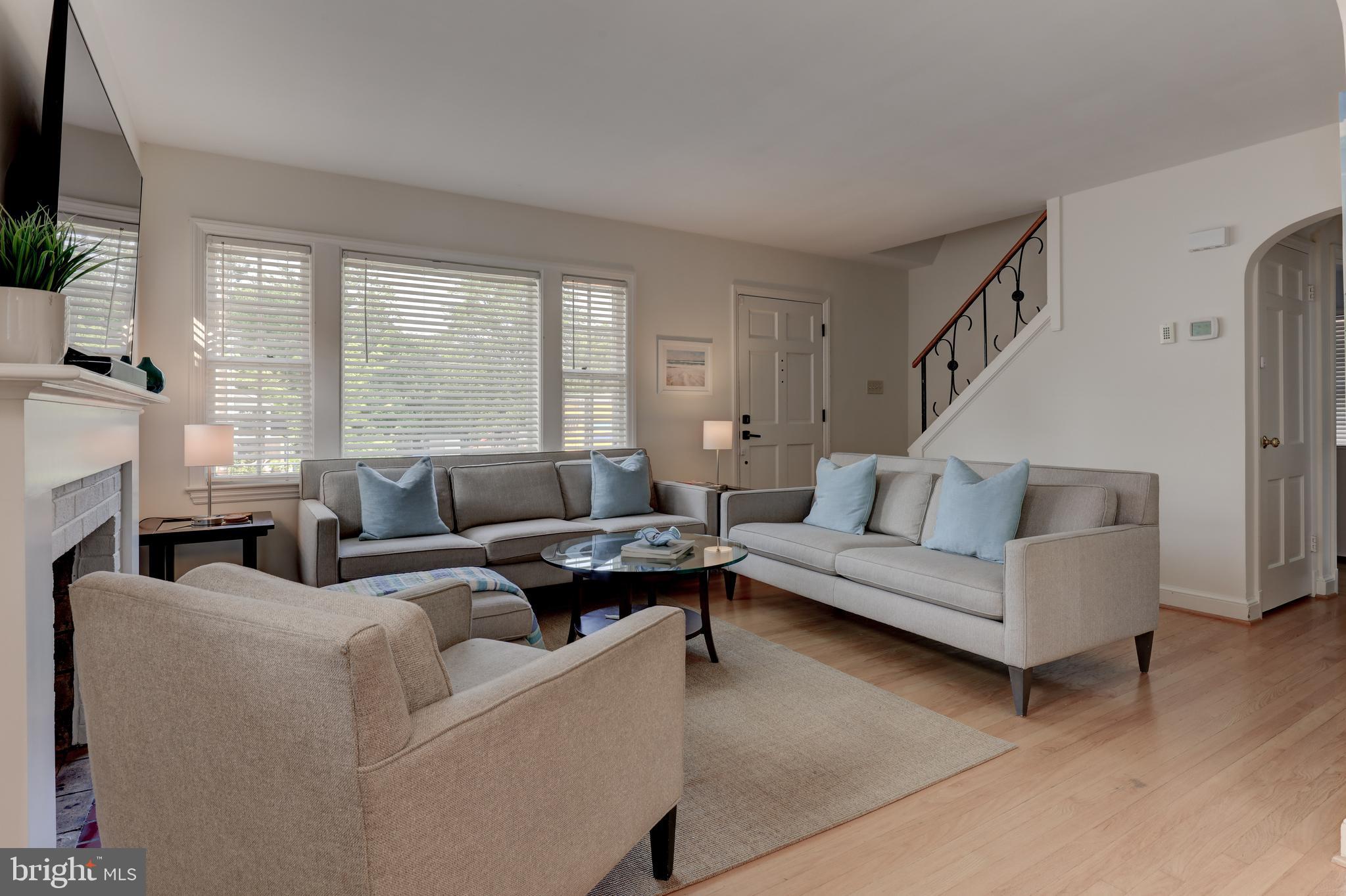 1723 Oakcrest Drive Alexandria, VA 22302 - Photo 2 of 17 a living room with furniture and a fireplace
