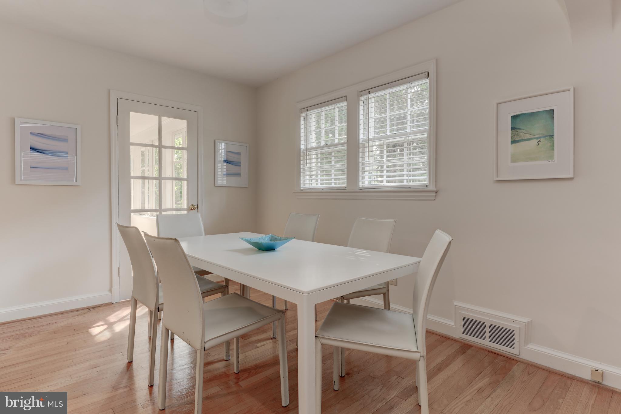 1723 Oakcrest Drive Alexandria, VA 22302 - Photo 9 of 17 a view of a dining room with furniture window and wooden floor